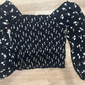 Chic Black Blouse with Floral Design and Elegant Silhouette